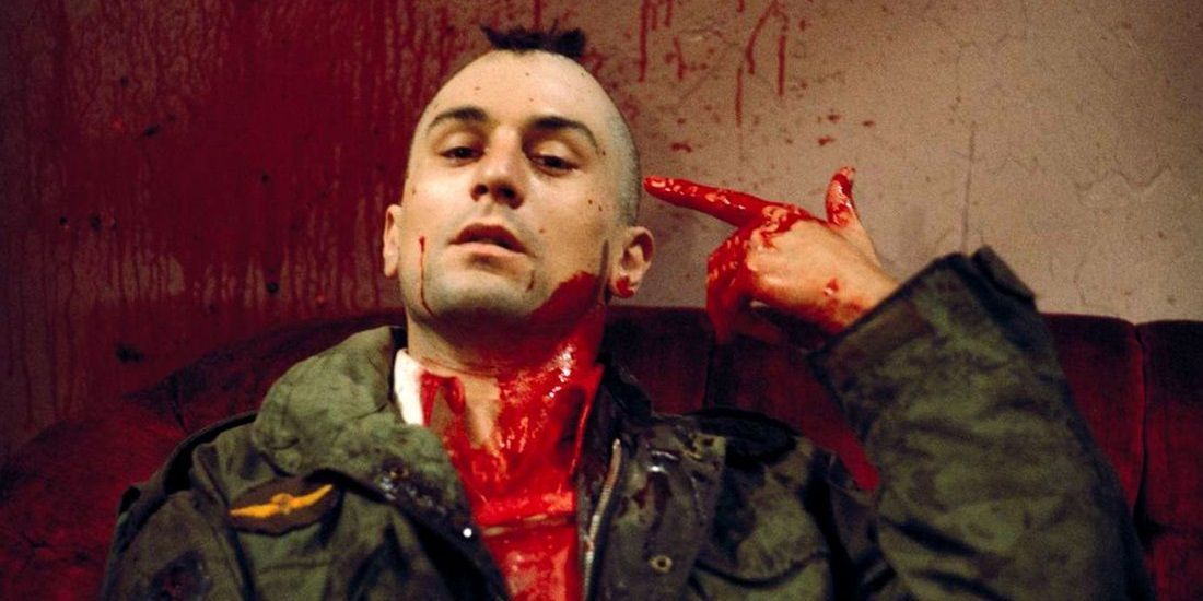 Travis pointing a finger-gun at his head in Taxi Driver