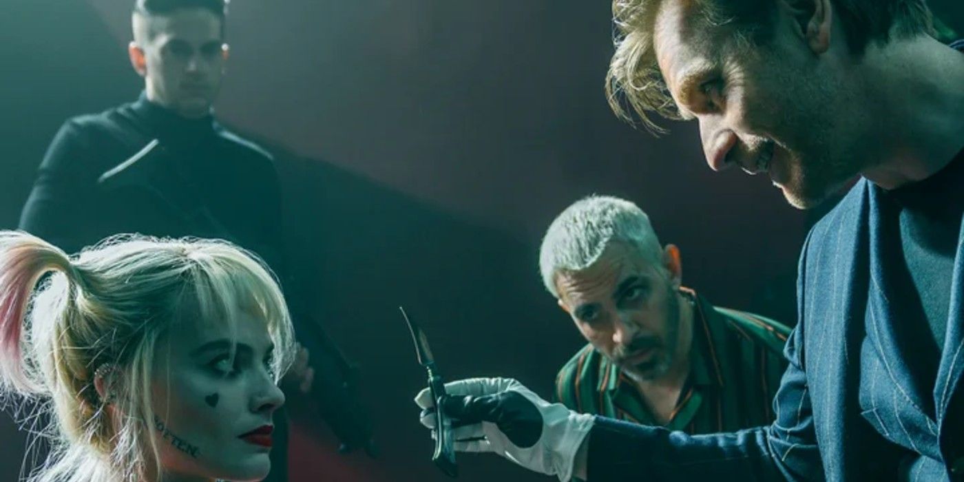 Black Mask holds a blade up to Harley Quinn in Birds of Prey
