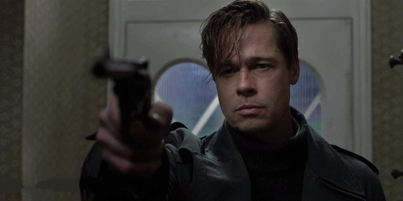 Brad Pitt holding a gun in Allied