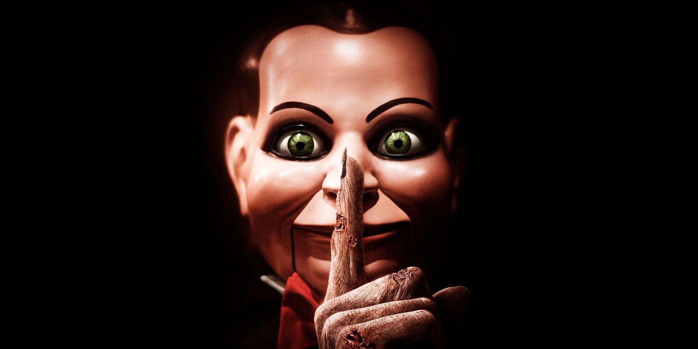 An evil-looking doll doing the silence sign in 2007's Dead Silence