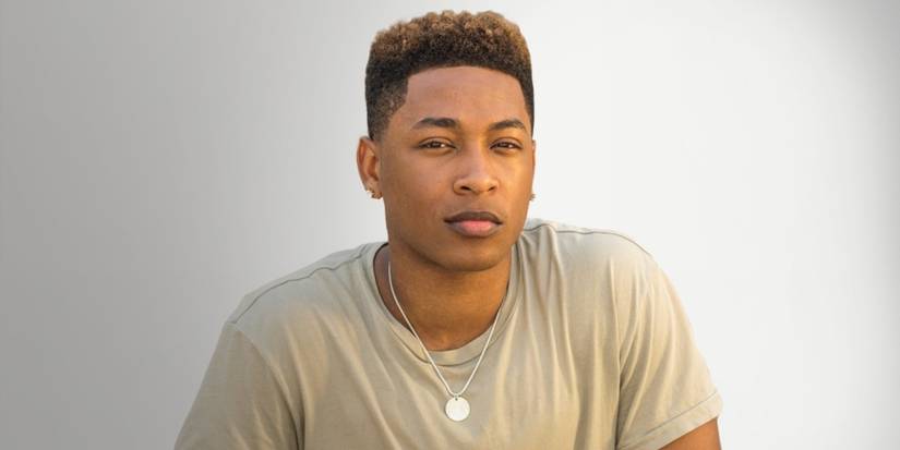 Emmett (Jacob Latimore) smiling in The Chi