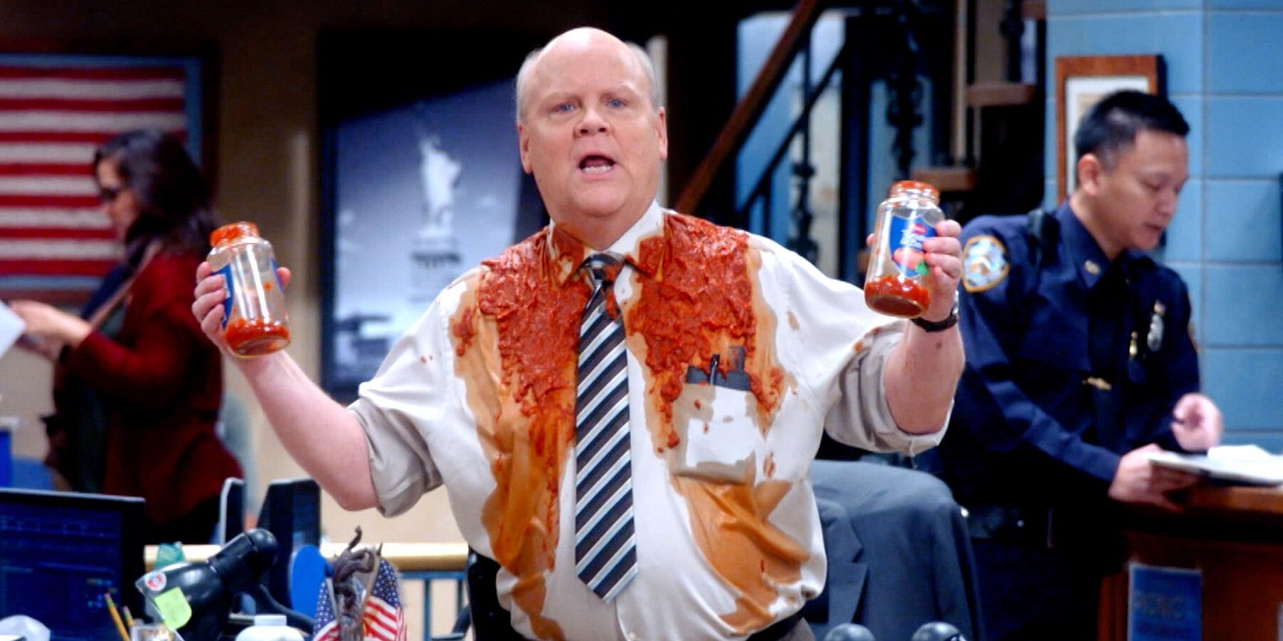 Michael Hitchcock covered in sauce in Brooklyn 99