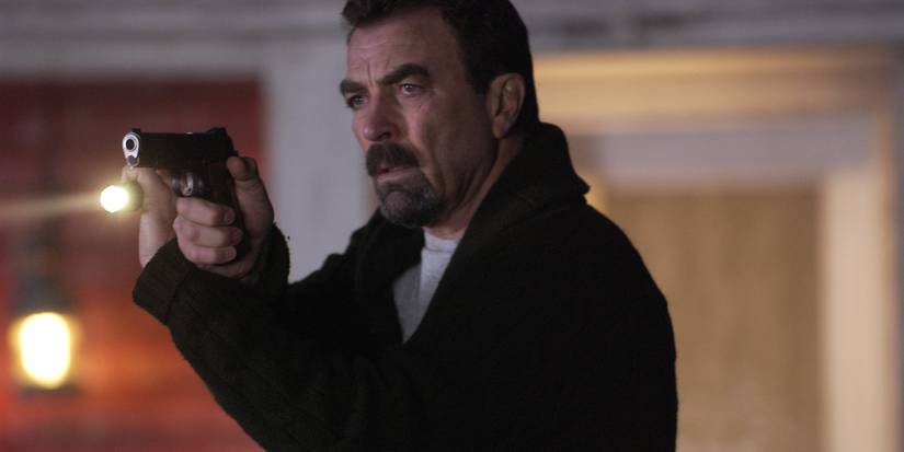 Tom Selleck holds a pistol in Jesse Stone: Stone Cold
