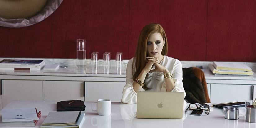 Susan (Amy Adams) sitting at a computer in Noctural Animals