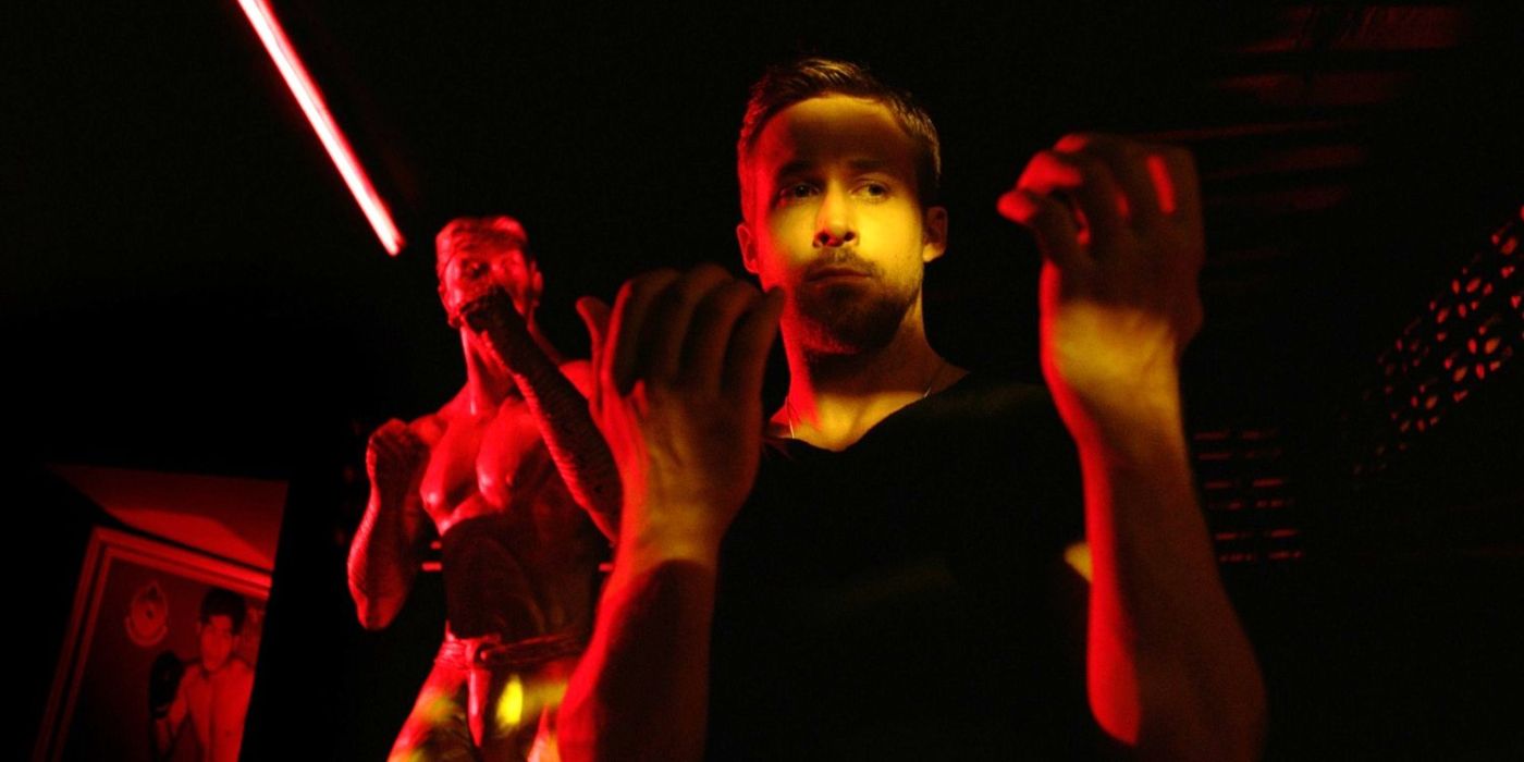 A man standing in between shadows in Only God Forgives