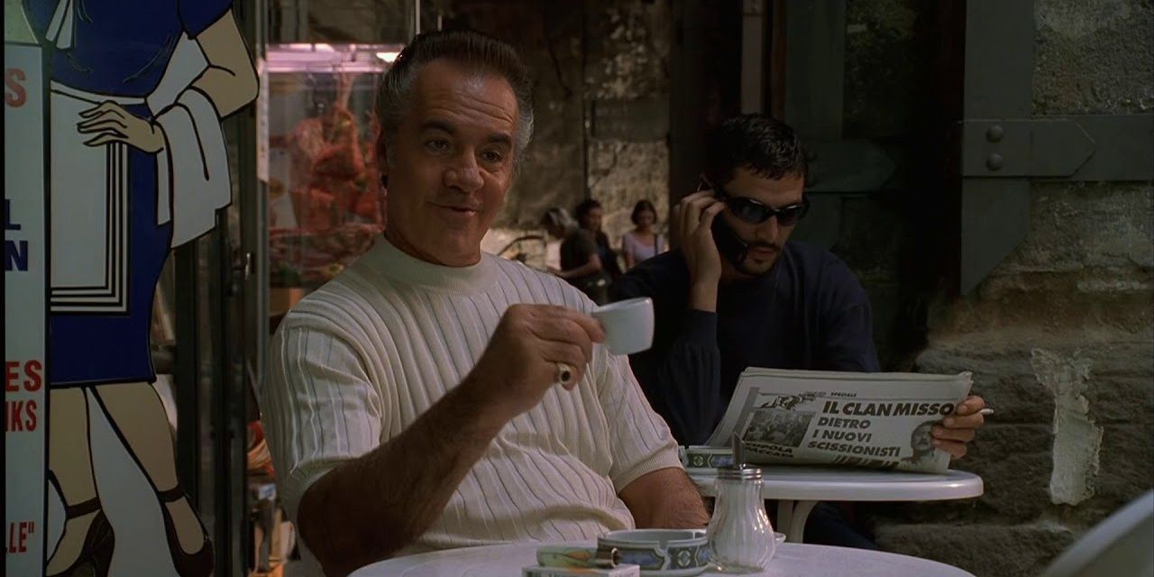 Paulie raises a cup of coffee in The Sopranos