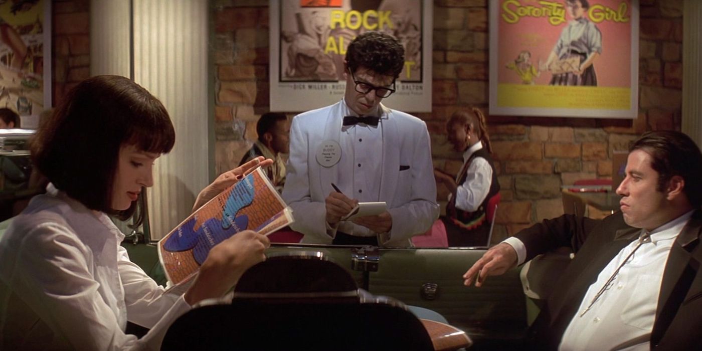 Vince and Mia are waited on by Buddy Holly in Jack Rabbit Slims in Pulp Fiction