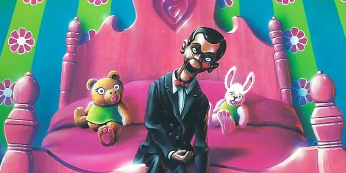 Slappy sitting on a pink bed in Goosebumps.