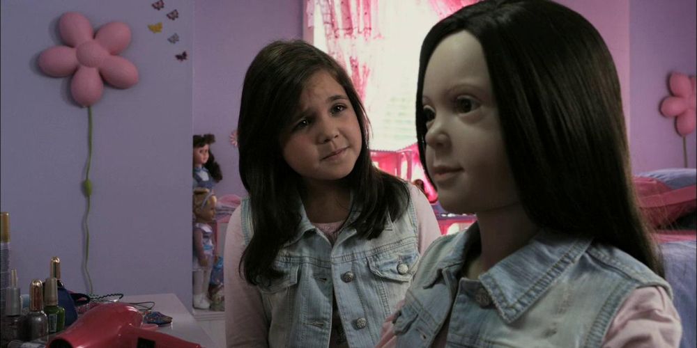 Lilly and her doll that looks like her in The Haunting Hour