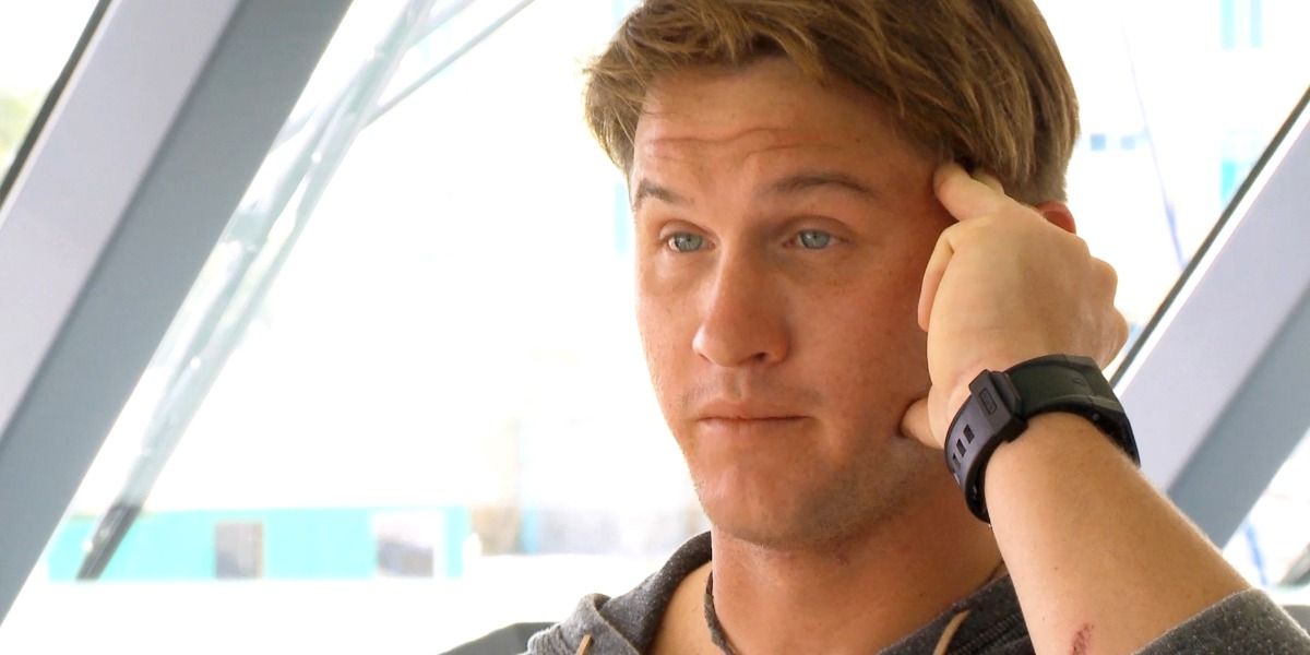 Trevor Walker looks surprised while talking to someone off camera on Below Deck