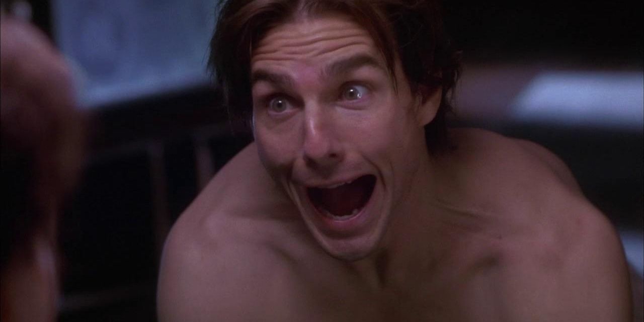Johnny topless and pulling a funny face in the mirror in Vanilla Sky