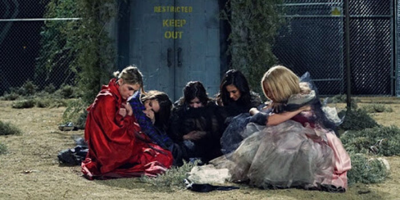 Hanna, Spencer, Aria, Emily, and Mona sitting on the ground on PLL