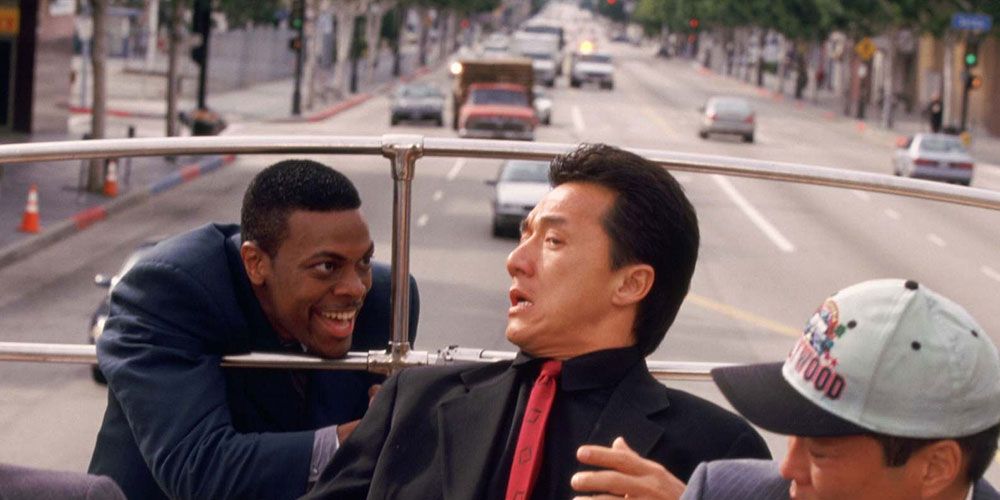Carter holding Lee at gunpoint on a bus in Rush Hour