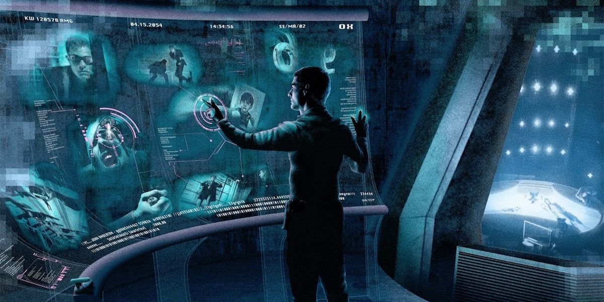 Tom Cruise touching a holographic futuristic computer in Minority Report.