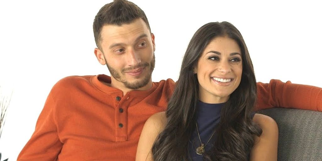 90 Day Fiance Loren and Alexei Cropped smiling on the couch