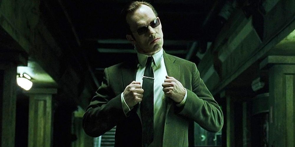 Agent Smith holding his suit in the movie, The Matrix