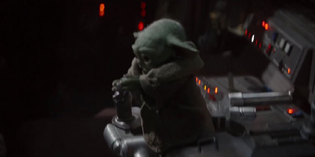 Baby Yoda steers the Razor Crest in The Mandalorian