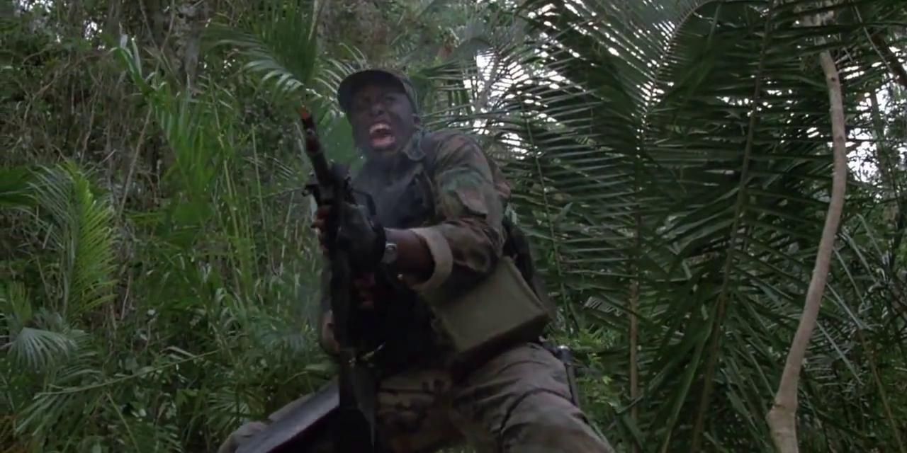 Mac Elliot firing a gun in Predator