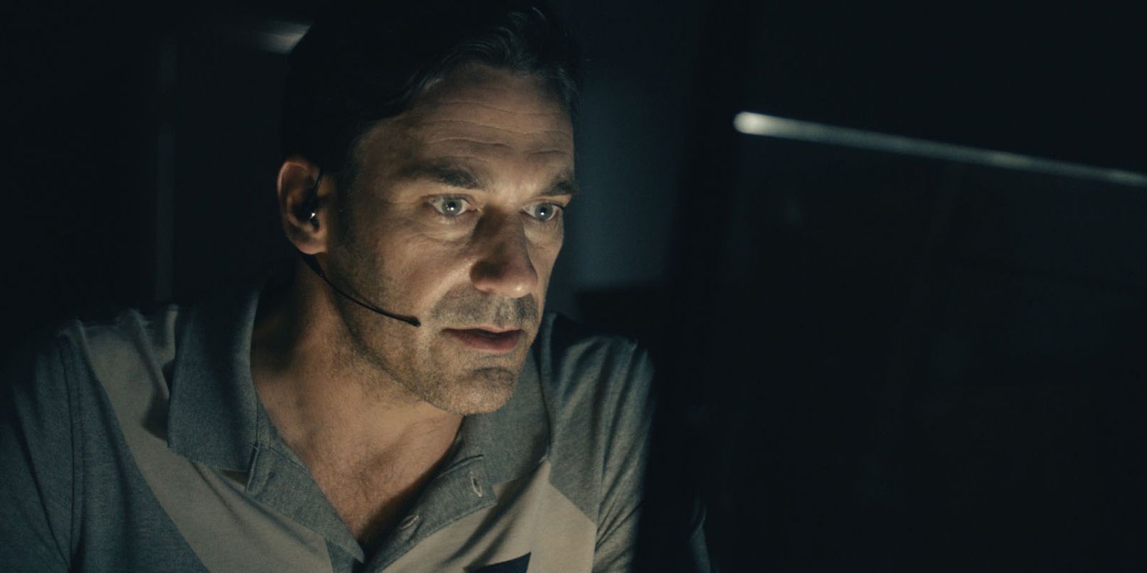 Jon Hamm looking at a computer screen in shock in Black Mirror White Christmas