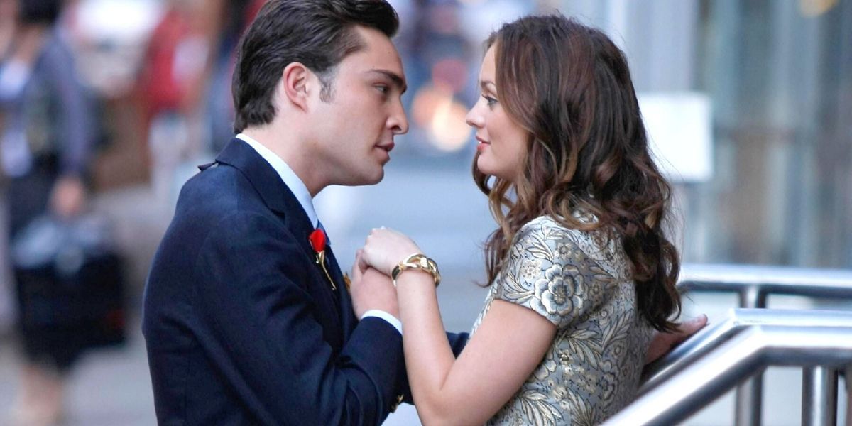 Chuck and Blair holding hands and looking at each other in Gossip Girl