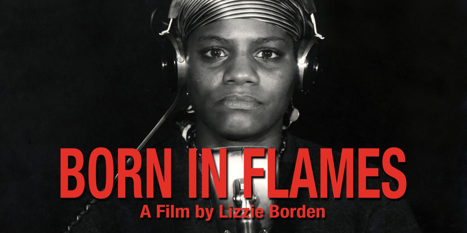 Lizzie Borden's Born in Flames title screen showing the title, director's name, and Adelaide Norris