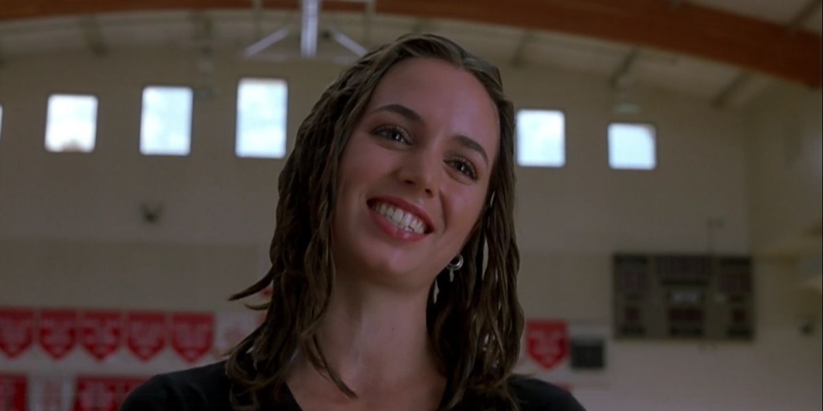 Missy smiling in the gym in Bring It On