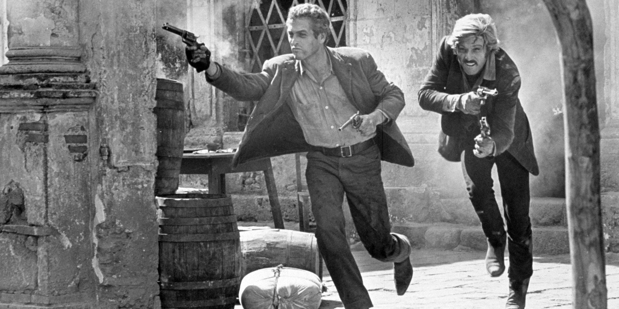 Butch and Sundance run out of the barn in Butch Cassidy And The Sundance Kid