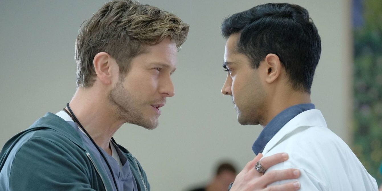 Matt Czuchry as Dr. Conrad Hawkins talking intensely to Dr. Pravesh in The Resident