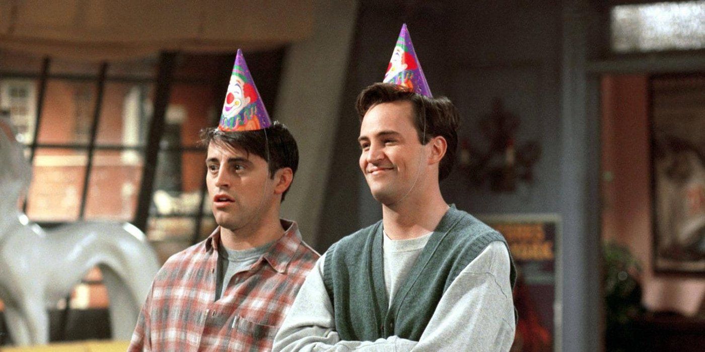 Chandler and Joey wearing party hats in Friends