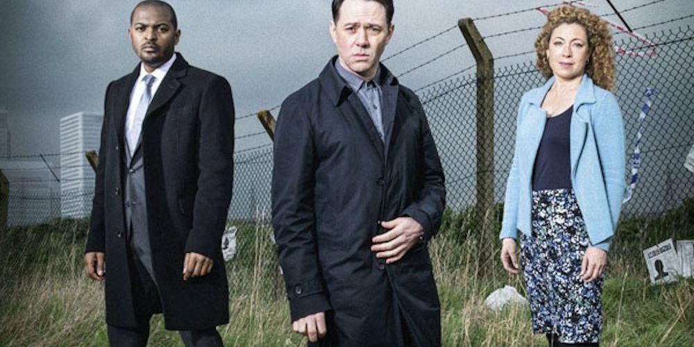 Three characters in a promo photo outside a prison for Chasing Shadows