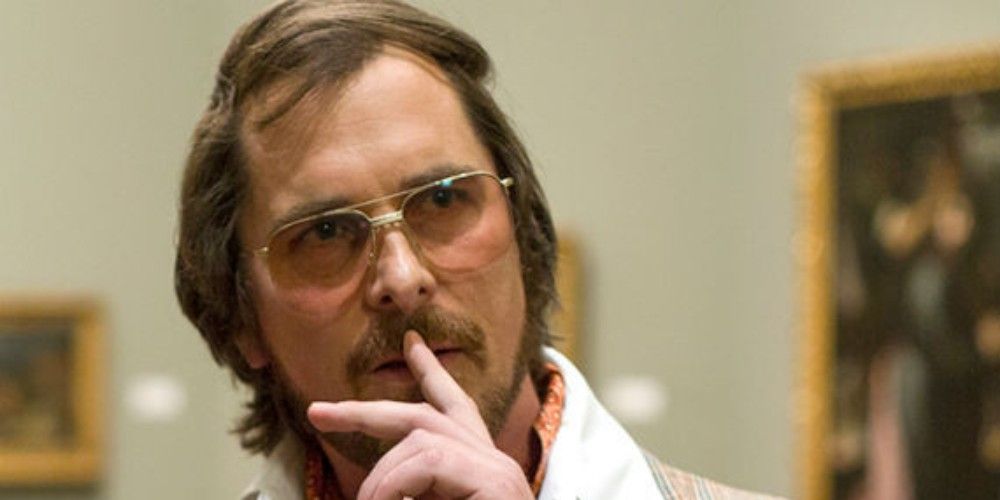 Christian Bale looks on in American Hustle