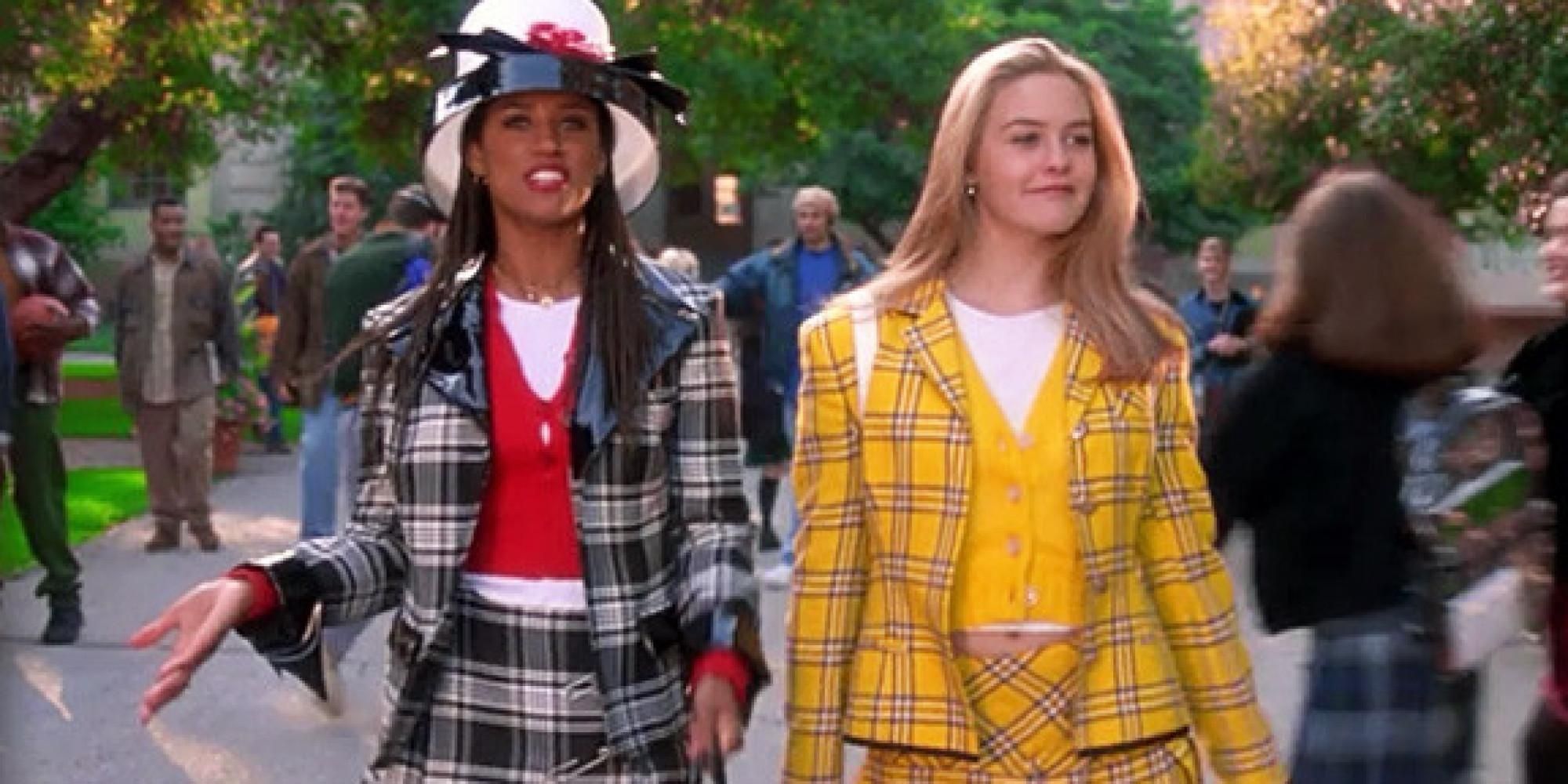Dionne and Cher wearing plaid outfits and walking outside in Clueless