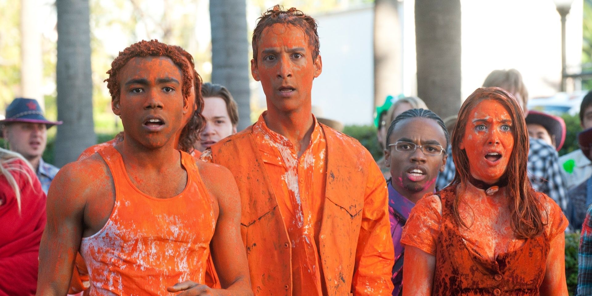 Troy, Abed, and Annie covered in orange paint in community