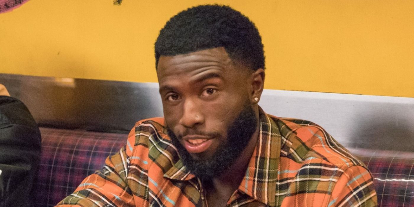 Daniel smirks at a diner in Insecure.