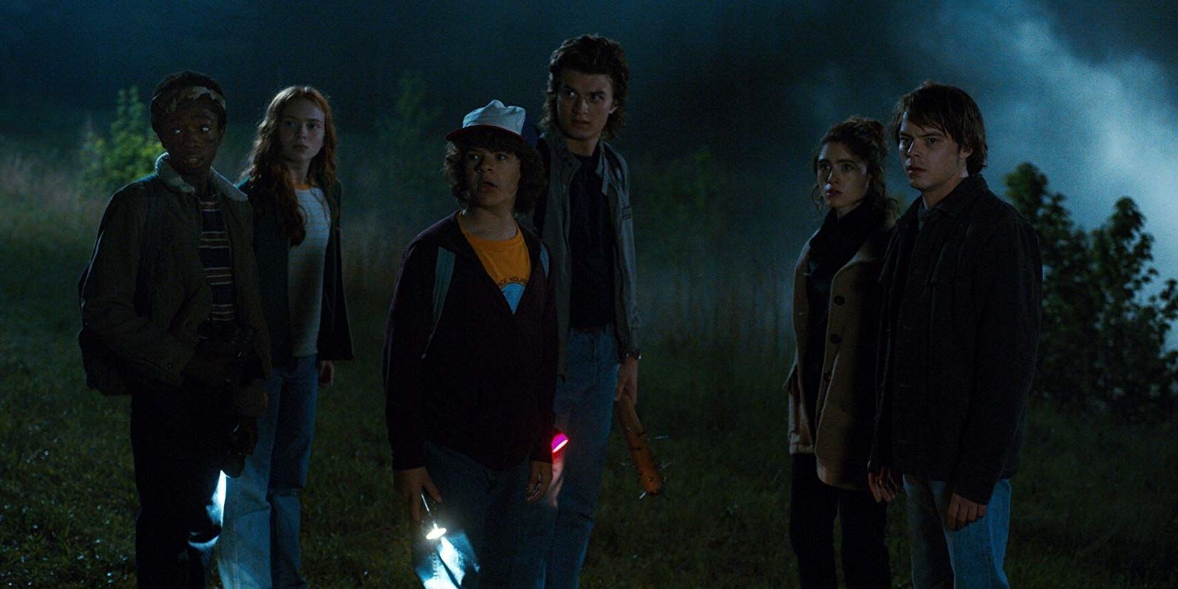 Lucas, Max, Dustin, Steve, Nancy, and Jonathan stand outside Hawkins labs before demodogs attack in Stranger Things Season 2
