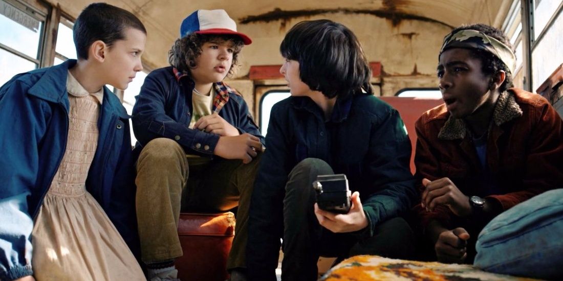 Eleven, Dustin, Mike, and Lucas in the bus in Stranger Things Season 1