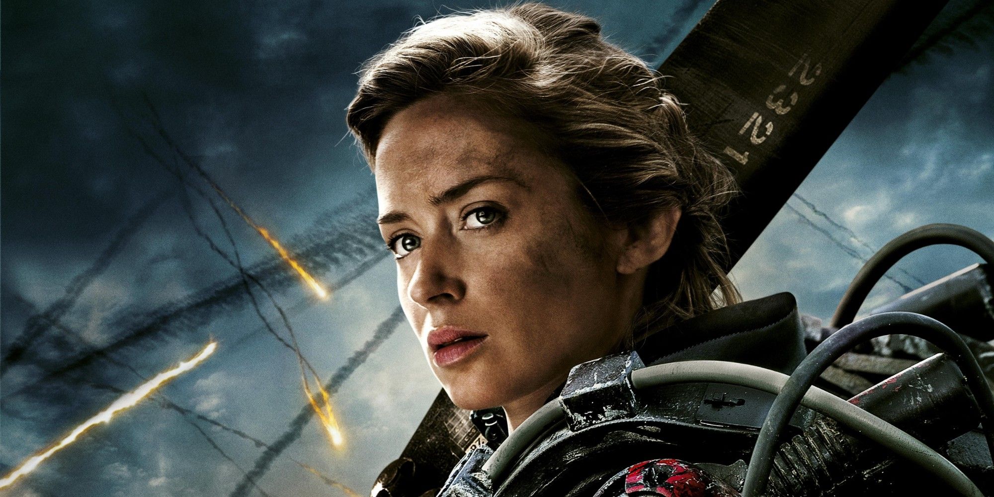 Emily Blunt stands on a battlefield in Edge of Tomorrow.