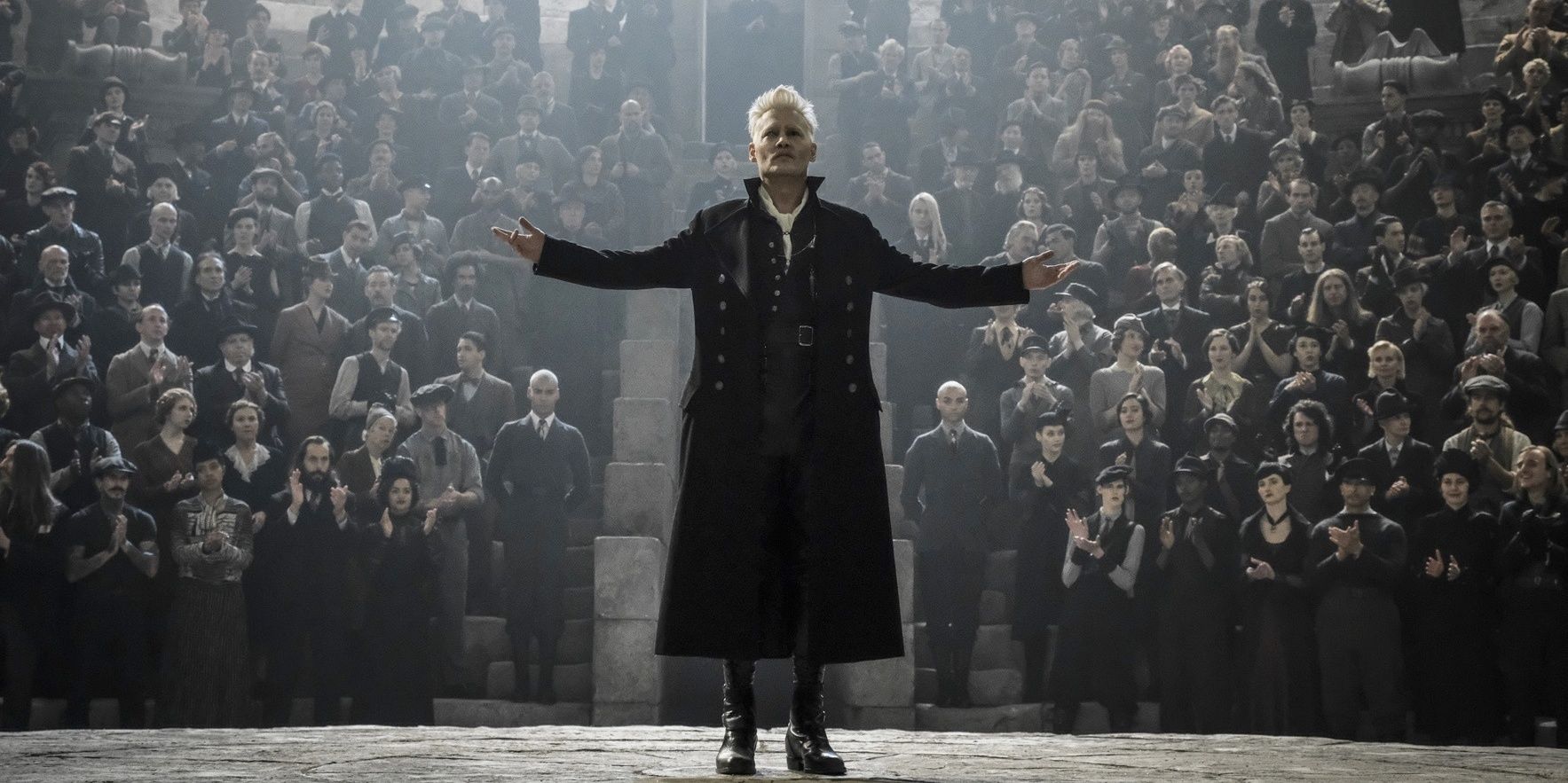Grindelwald speaking to a crowd of people in Harry Potter. 