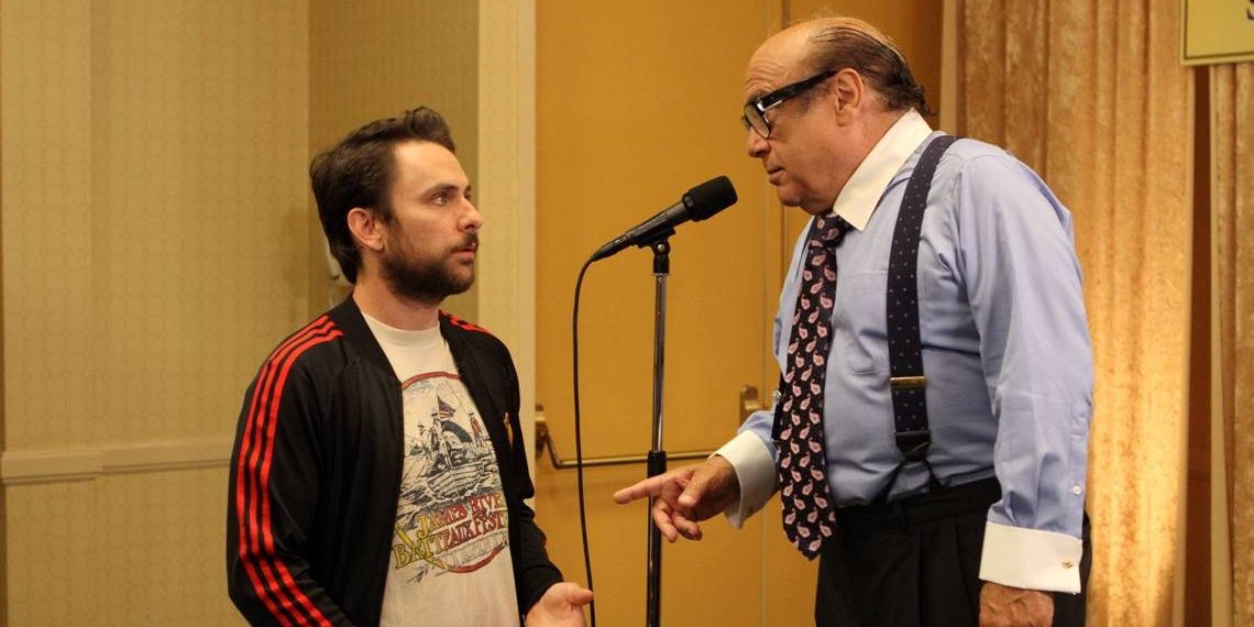 Frank standing in front of a mic and talking to Charlie in It's Always Sunny in Philadelphia.