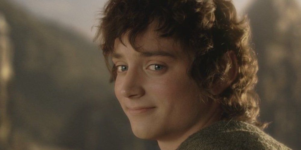 Frodo smiling and looking back in The Lord of the Rings