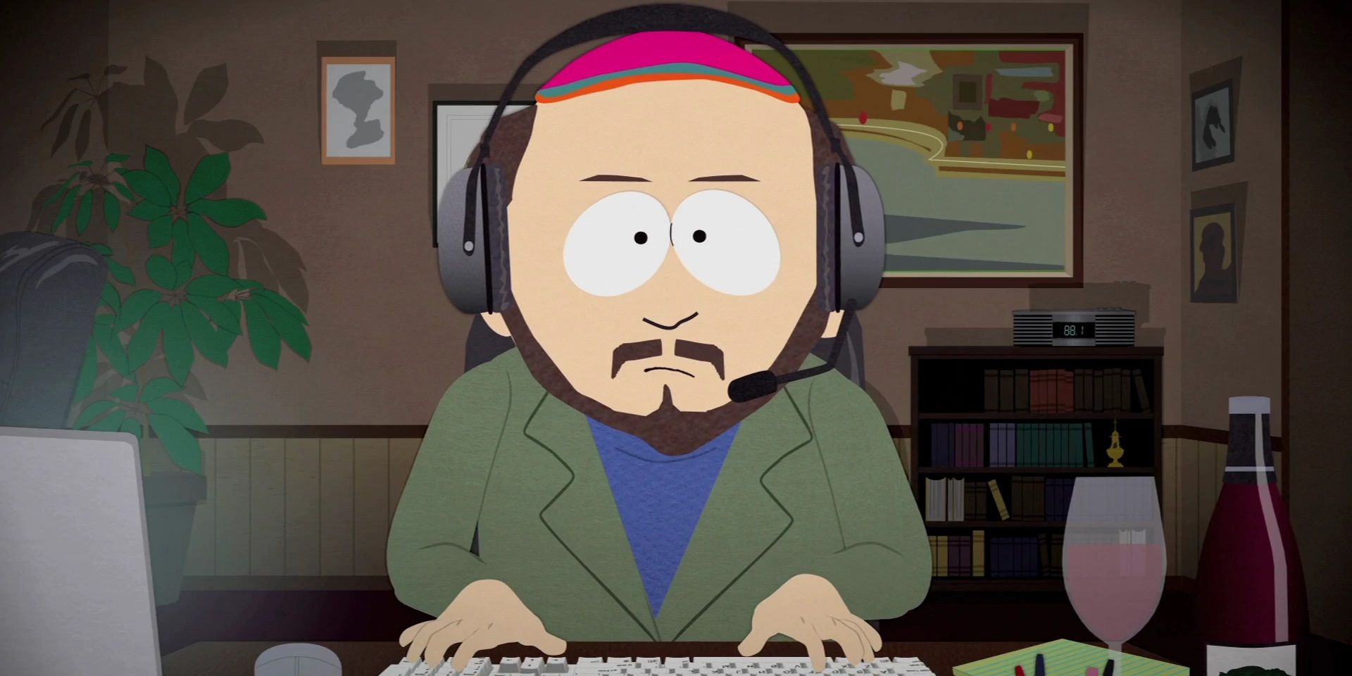 Gerald wearing headphones and typing in South Park.