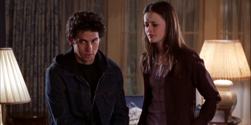 Jess and Rory standing in a bedroom and having a fight on Gilmore Girls