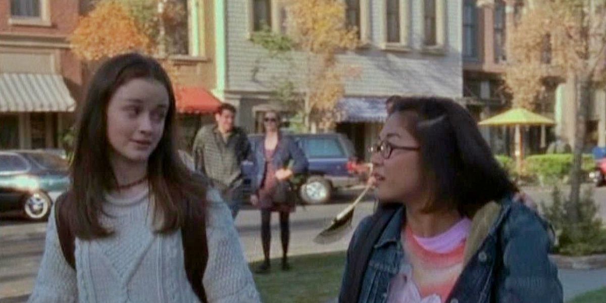Rory and Lane walking on the streets of Stars Hollow on Gilmore Girls