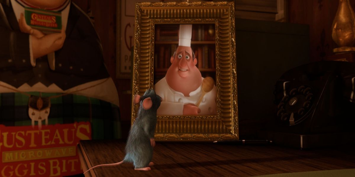 Remy looking at a framed photo of Gusteau in Ratatouille