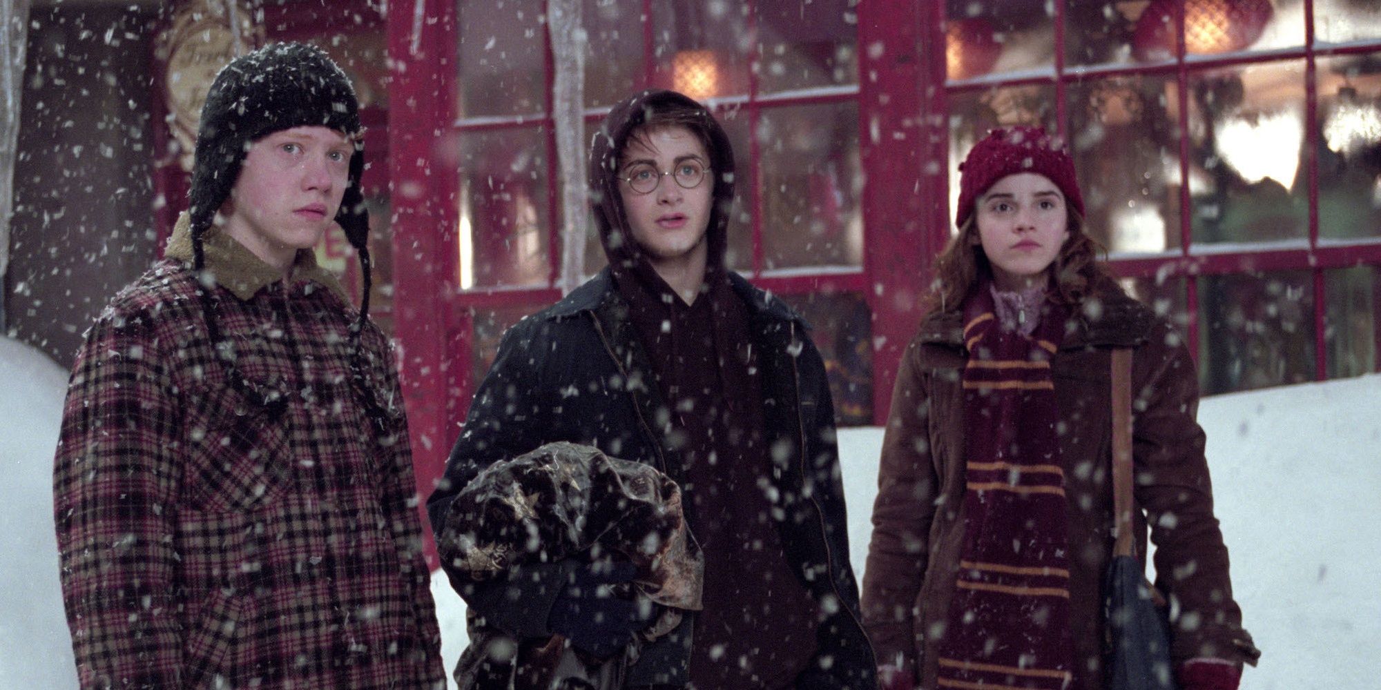 Harry Ron and Hermione in Hogsmeade in winter