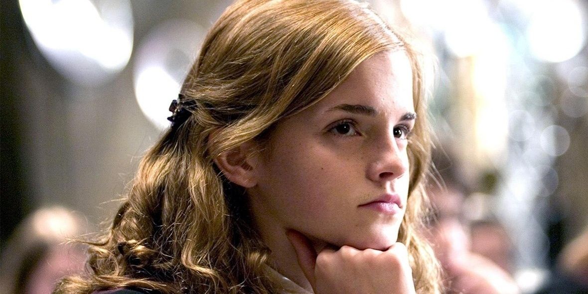 Hermione granger resting her chin on her first in Harry Potter. 