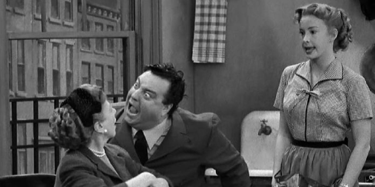 Jackie Gleason as Ralph Kramden shouts in his mother-in-law's face while Alice (Audrey Meadows) prepares to interject