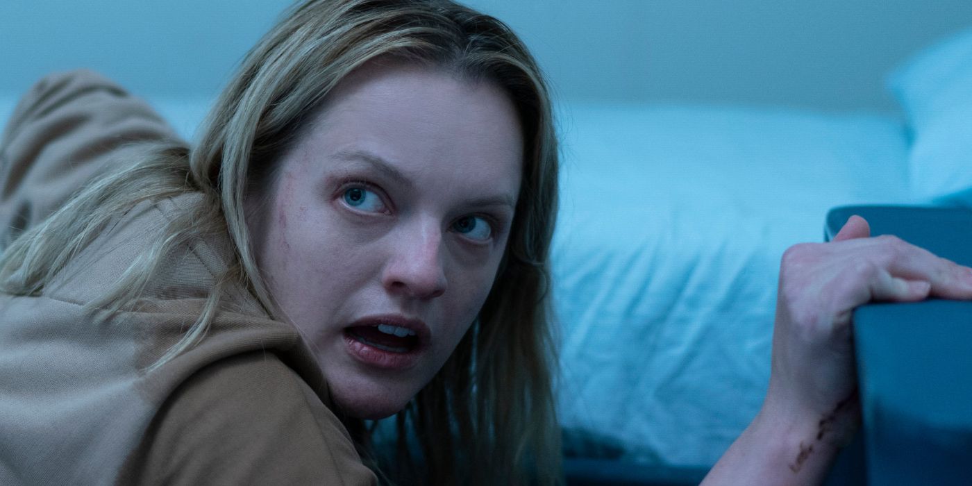 Elizabeth Moss looking scared in her cell in The Invisible Man