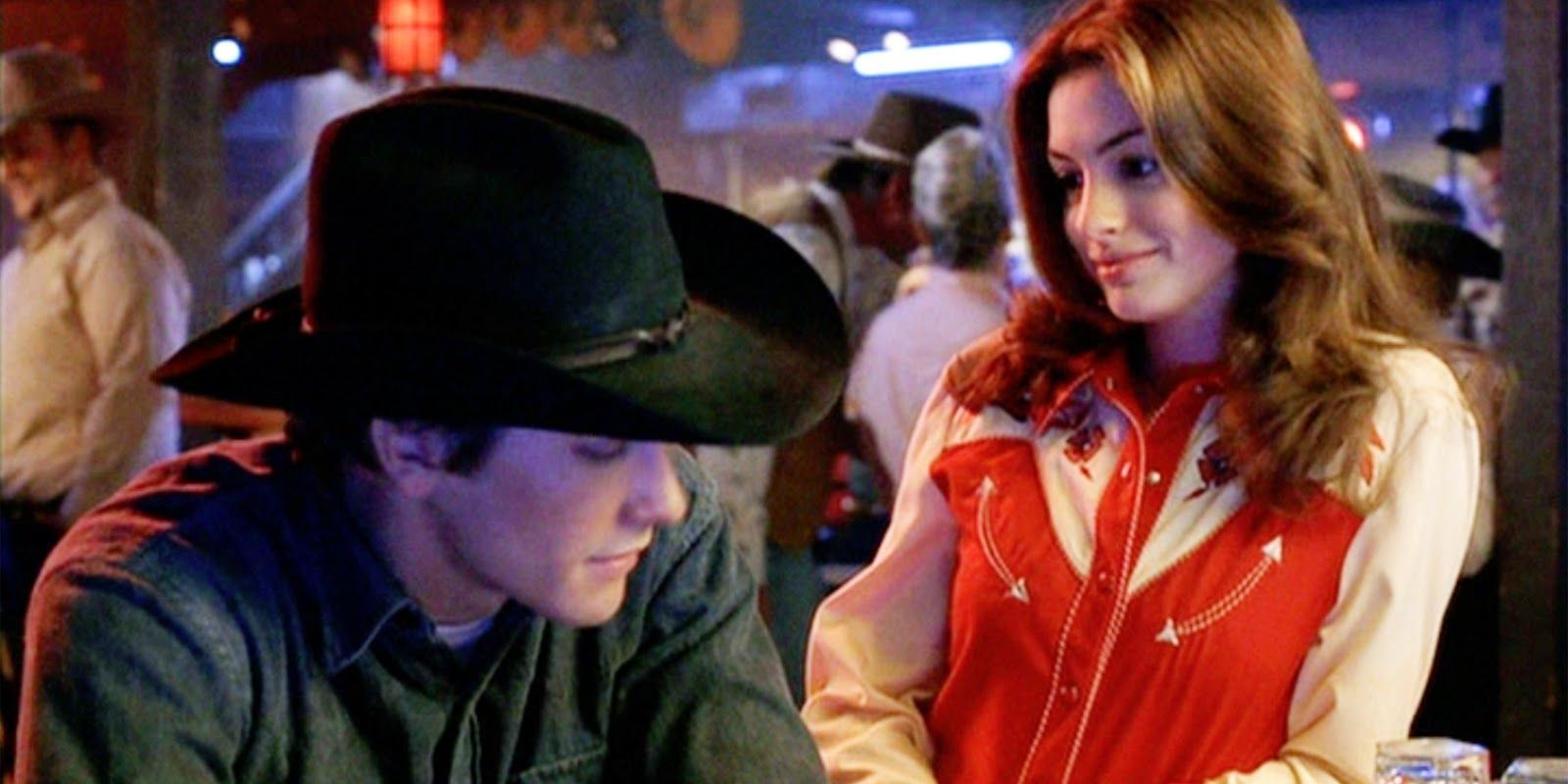 Jake Gyllenhaal and Anne Hathaway at a bar in Brokeback Mountain