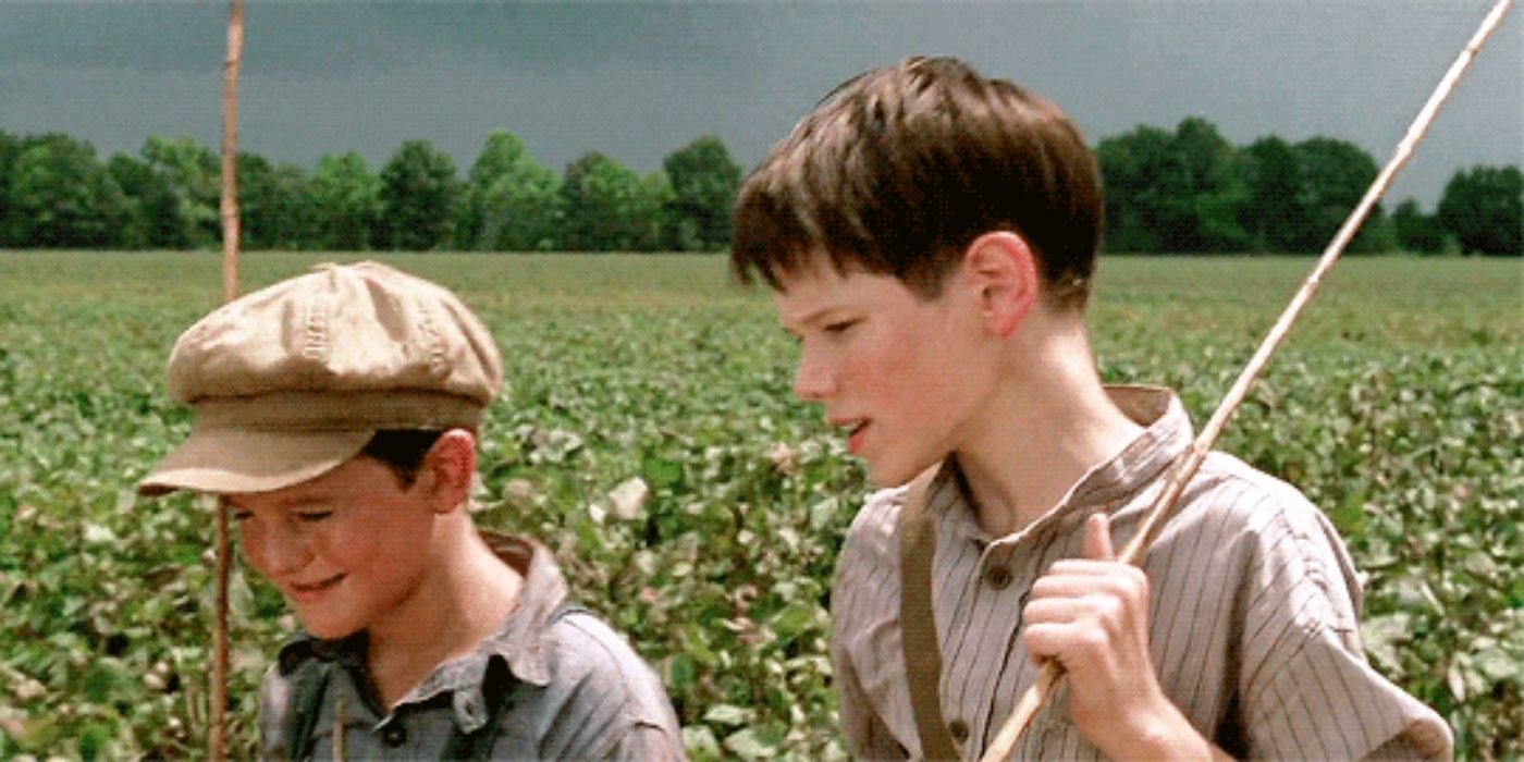 Johnny and Jack walking in the field talking on Walk the Line